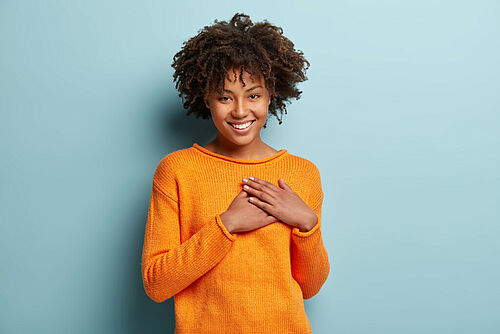 Woman touches her heart
